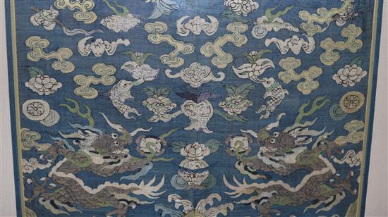 A Chinese blue silk kesi dragon panel, 17th century, 99cm x 61cm, wear and old repairs